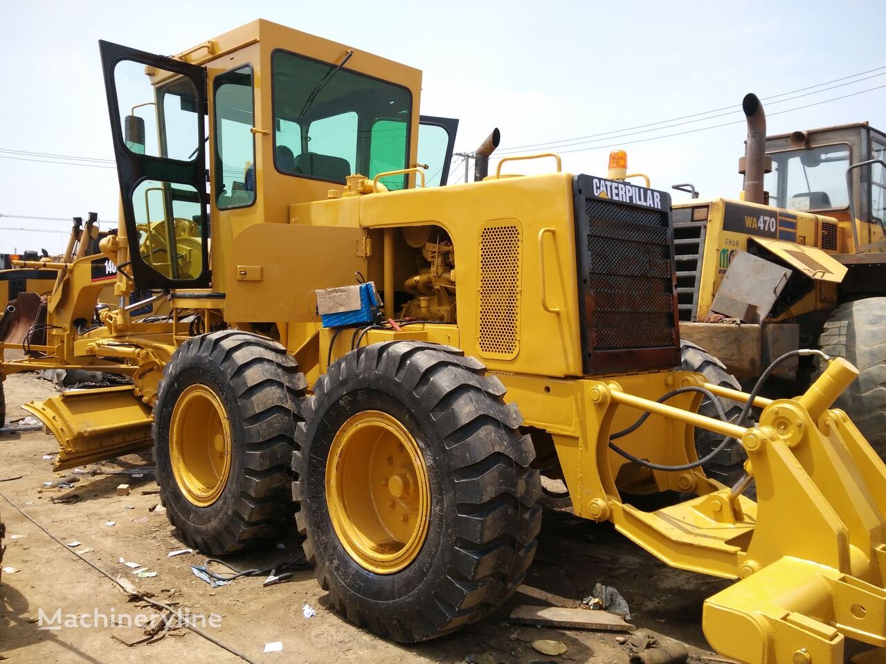 грейдер Caterpillar 140K